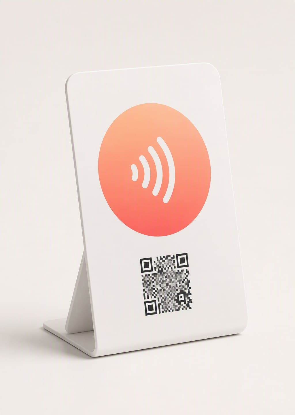 A white Tappivo counter stand with a coral tap zone, NFC wave symbol and QR code
